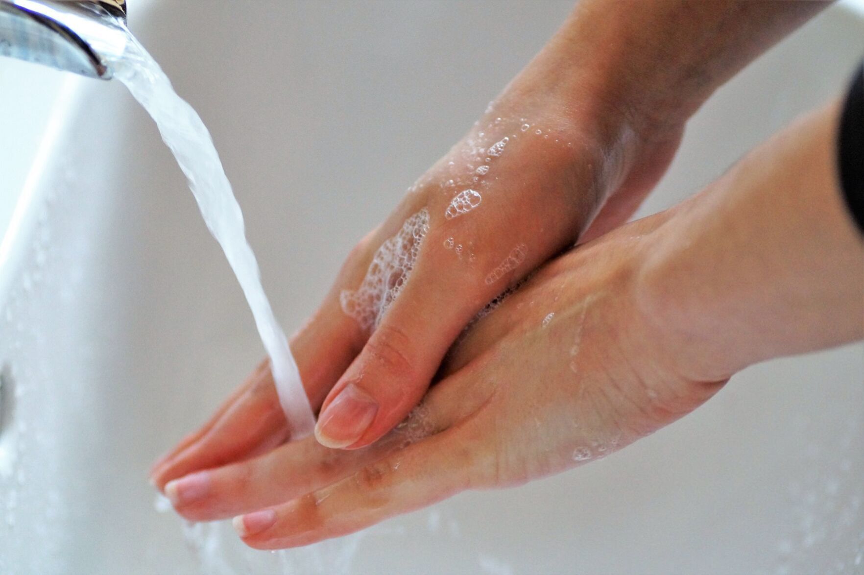 Wash area with soap and water